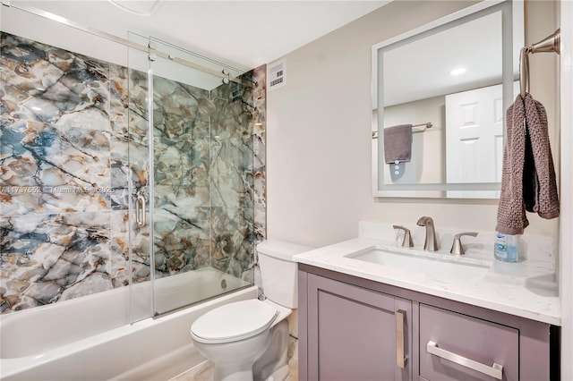 full bathroom featuring vanity, toilet, and combined bath / shower with glass door