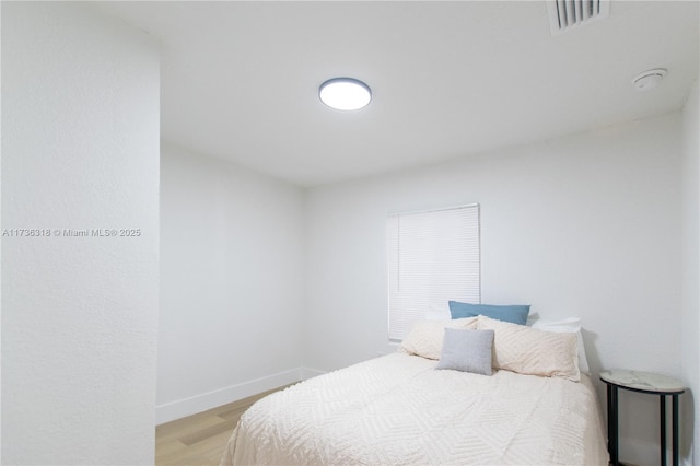 bedroom featuring light hardwood / wood-style floors