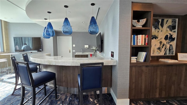 kitchen featuring sink and pendant lighting