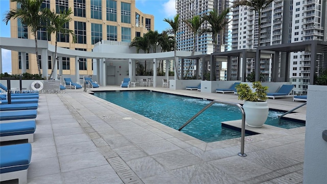 view of swimming pool with a patio area