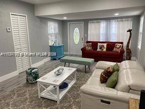 living room featuring dark wood-type flooring