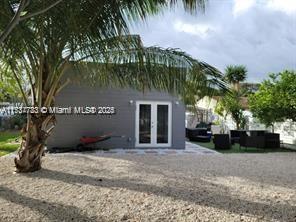 rear view of property with french doors