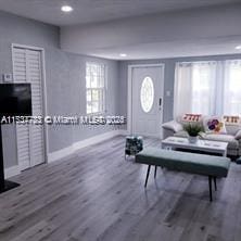 living room featuring dark wood-type flooring