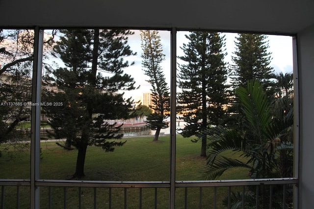 yard at dusk with a water view