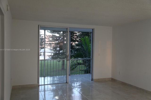 empty room featuring tile patterned flooring