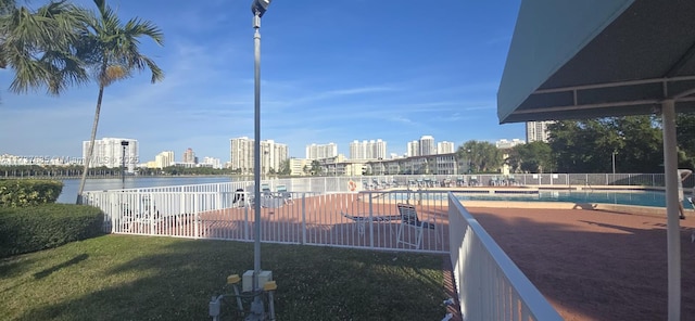 view of swimming pool with a water view