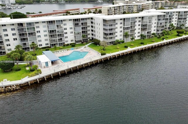 birds eye view of property with a water view