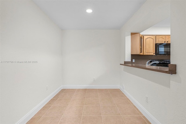 interior space featuring light tile patterned flooring