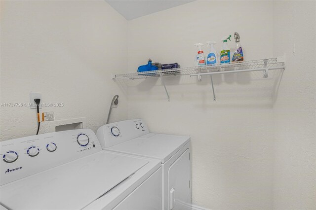 clothes washing area featuring washer and dryer