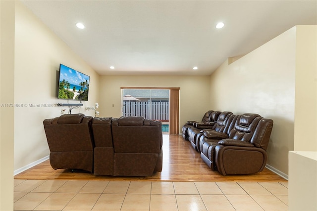 living area with light tile patterned floors, recessed lighting, and baseboards