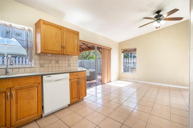 kitchen featuring white dishwasher, decorative backsplash, a sink, and light tile patterned flooring