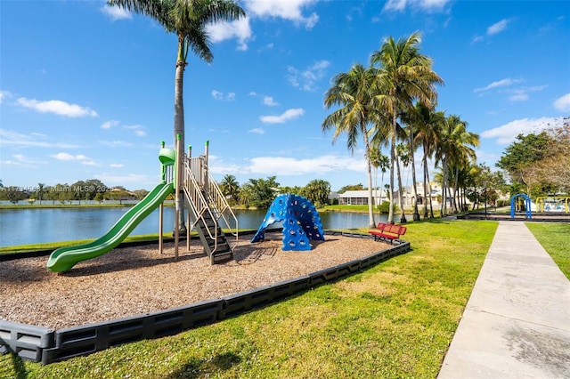 community playground featuring a yard and a water view