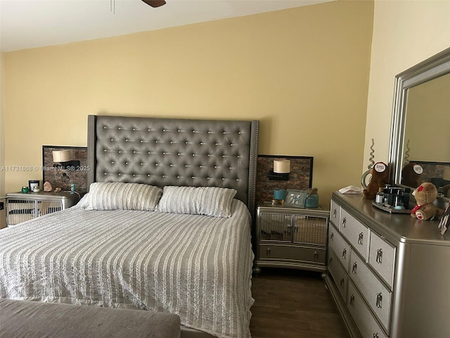 bedroom with dark hardwood / wood-style floors