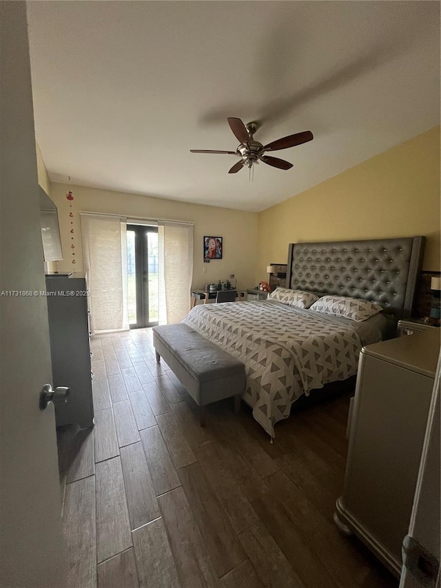 bedroom featuring lofted ceiling, ceiling fan, french doors, and dark hardwood / wood-style floors