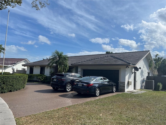 view of side of home with a garage and a yard