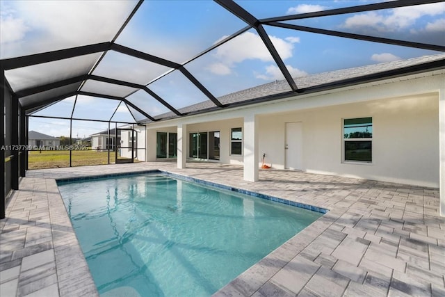 view of pool featuring a lanai and a patio area