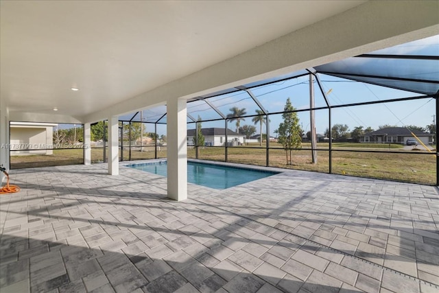 view of pool featuring a yard, a lanai, and a patio