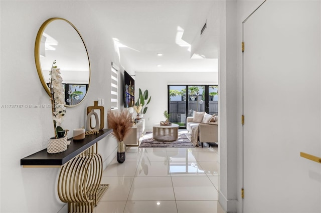 corridor featuring light tile patterned flooring