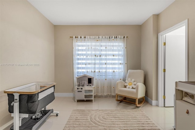 sitting room featuring light tile patterned flooring