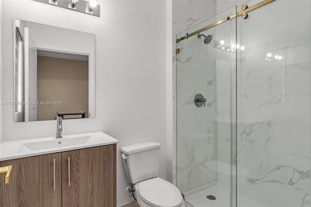 bathroom featuring vanity, toilet, and an enclosed shower