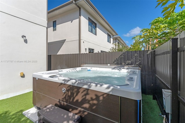 view of patio / terrace featuring a hot tub