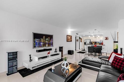 living room with a notable chandelier