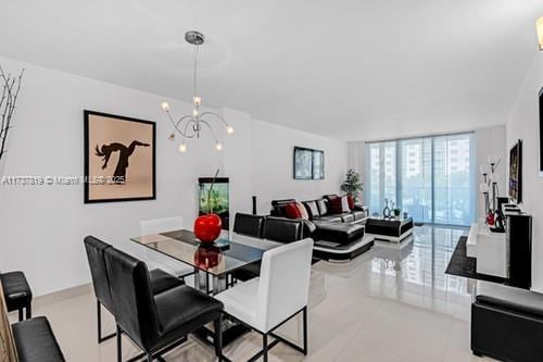 tiled dining area with expansive windows and a notable chandelier