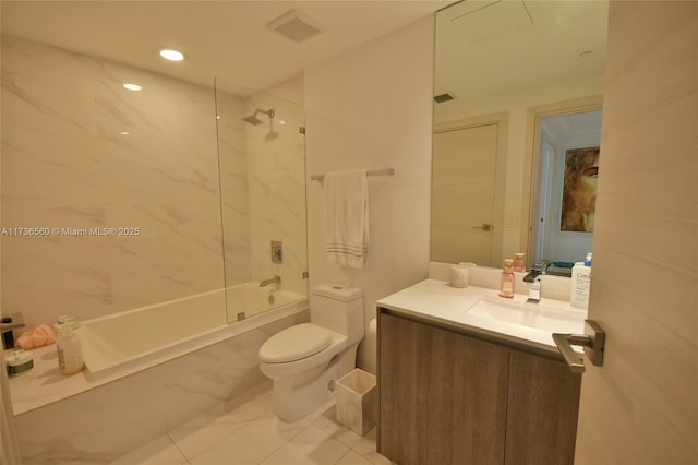 full bathroom with vanity, toilet, and tiled shower / bath combo