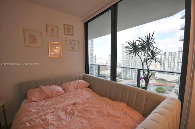 bedroom featuring a water view