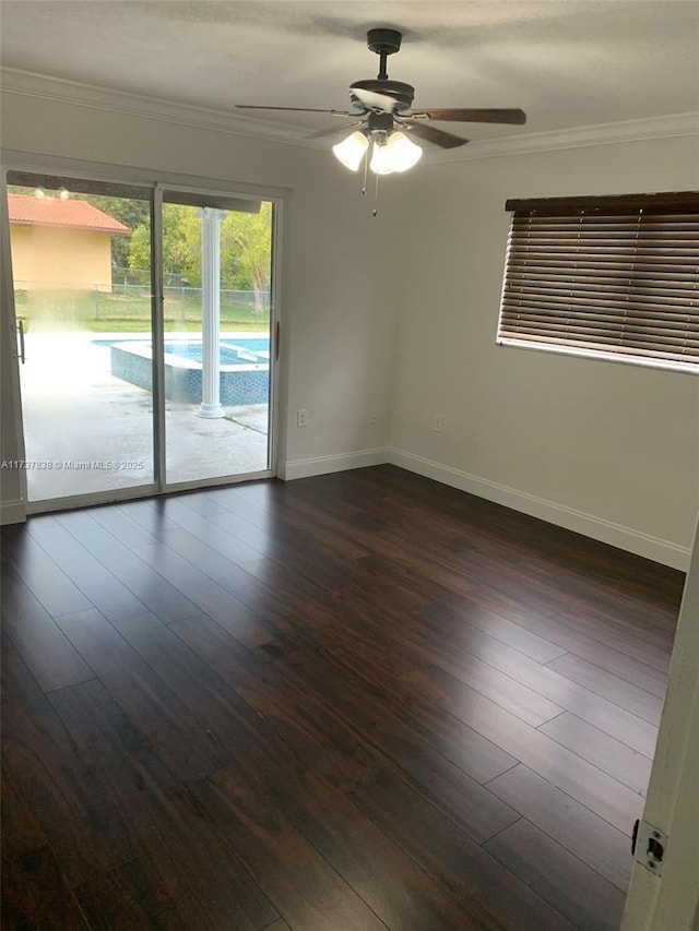 spare room featuring crown molding, ceiling fan, and dark hardwood / wood-style flooring