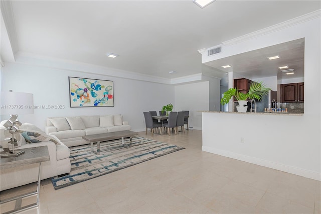 living room featuring crown molding