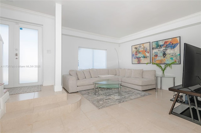 tiled living room with ornamental molding and french doors