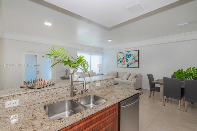 kitchen featuring sink, stainless steel dishwasher, and light stone countertops