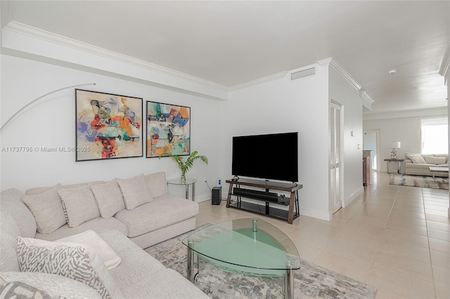 living room featuring ornamental molding and light tile patterned floors