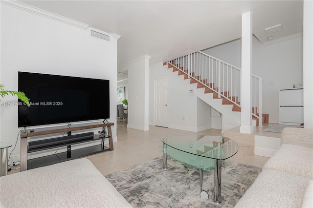 living room featuring ornamental molding and light tile patterned floors