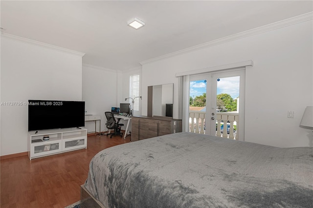 bedroom with access to exterior, dark wood-type flooring, ornamental molding, and french doors