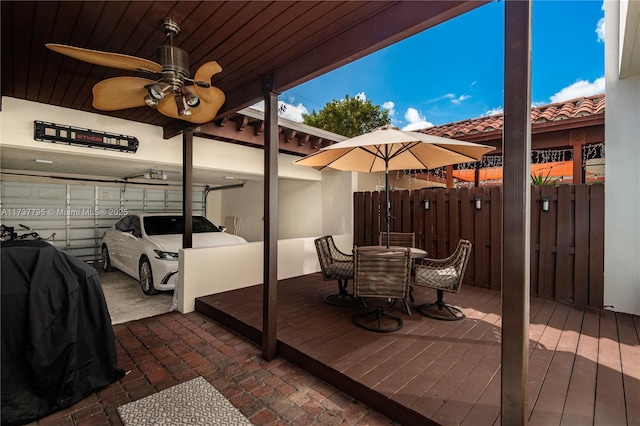 exterior space featuring ceiling fan