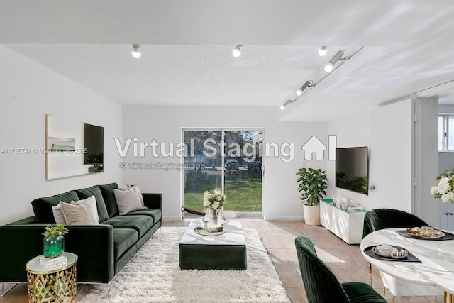 tiled living room featuring a textured ceiling