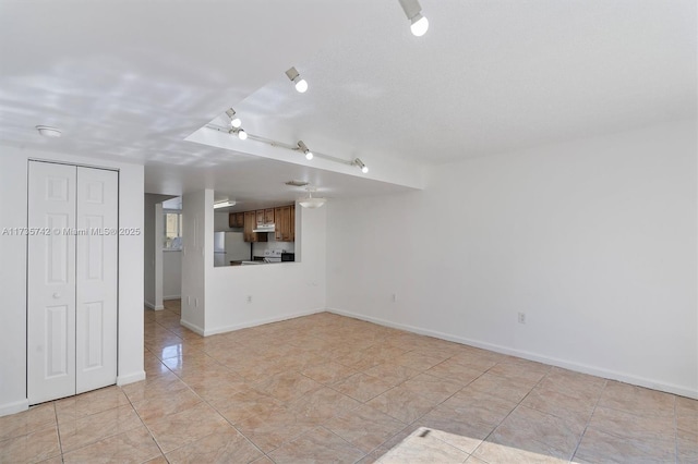 unfurnished living room with light tile patterned floors