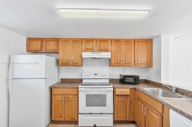 kitchen featuring white appliances and sink