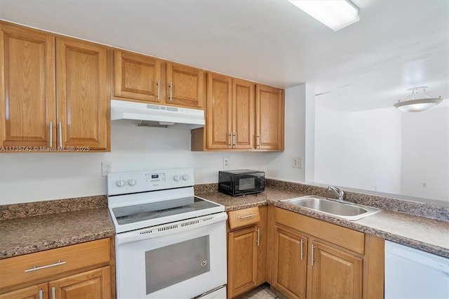 kitchen with white appliances and sink