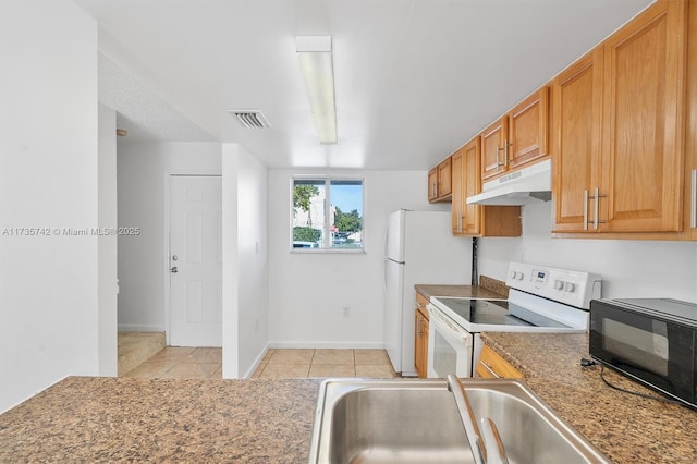 kitchen with light tile patterned flooring, sink, and white electric range oven