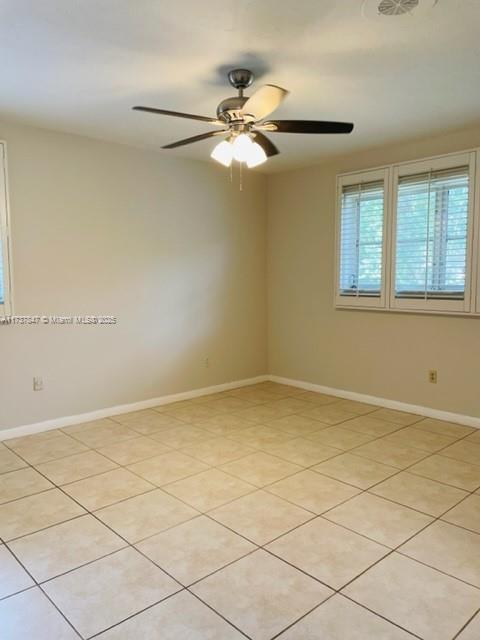 spare room with ceiling fan