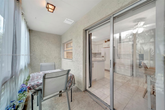 balcony with ceiling fan and a patio area