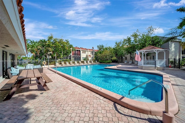 view of pool featuring a gazebo and a patio