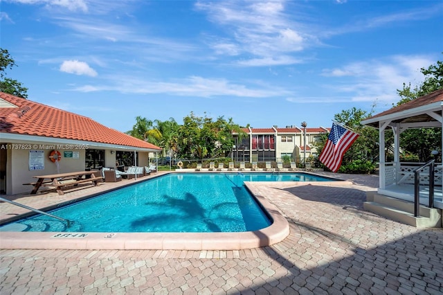 view of swimming pool with a patio area