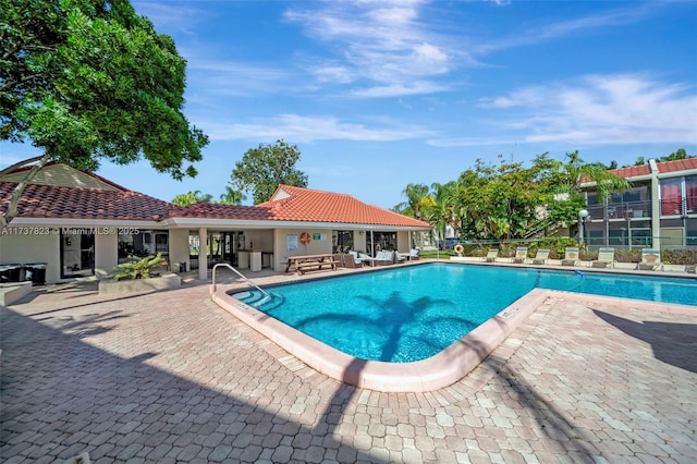 view of swimming pool featuring a patio