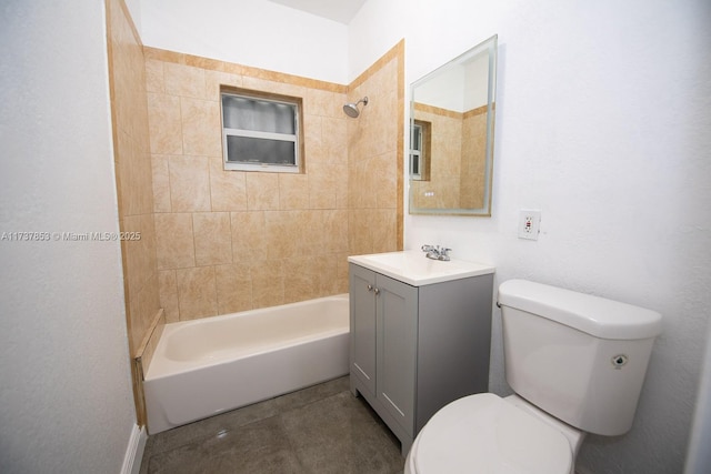 full bathroom with tiled shower / bath, vanity, toilet, and tile patterned flooring