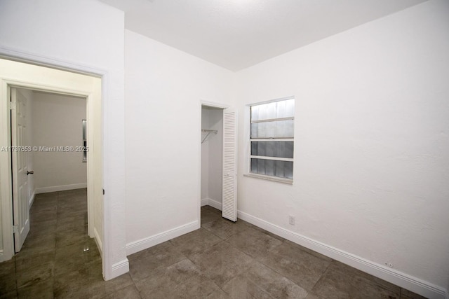 unfurnished bedroom featuring a closet