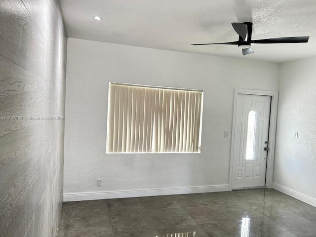 entrance foyer featuring ceiling fan